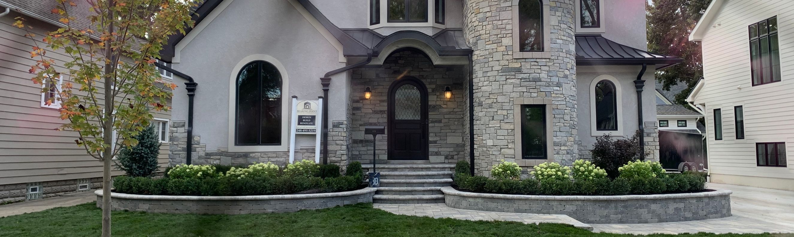 Brick walls and steps with paver walkway.